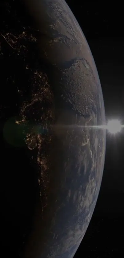 Earth from space with a sunrise glowing on the horizon, showcasing the planet's beauty.