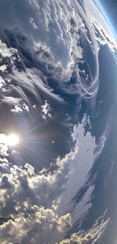 View of Earth from space with clouds and sunlight.