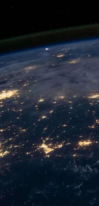 Stunning nighttime view of Earth from space, highlighting city lights.