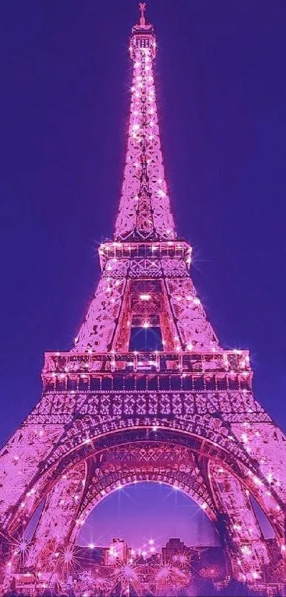 Elegant Eiffel Tower lit at night in purple and pink tones.