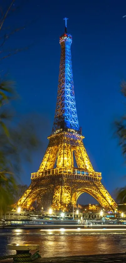 Eiffel Tower illuminated at night in Paris skyline.