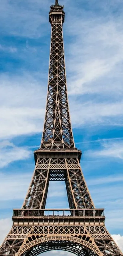 Eiffel Tower with blue sky and clouds in the background.