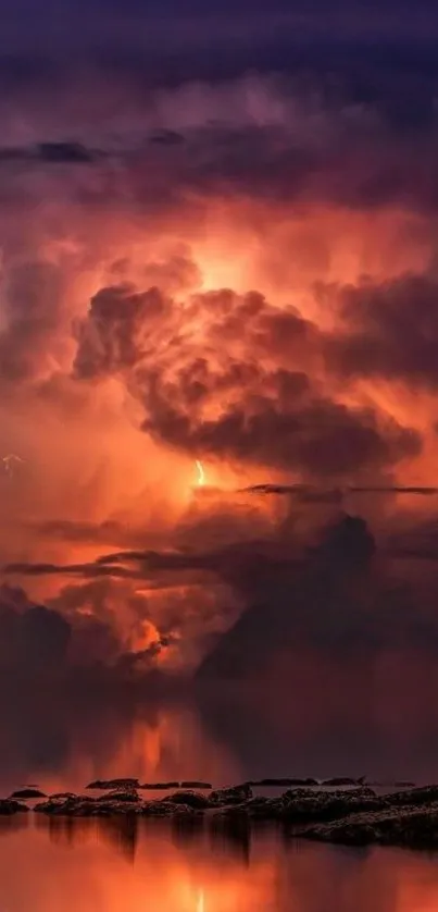 Fiery sky reflected in calm waters, showcasing dramatic clouds.