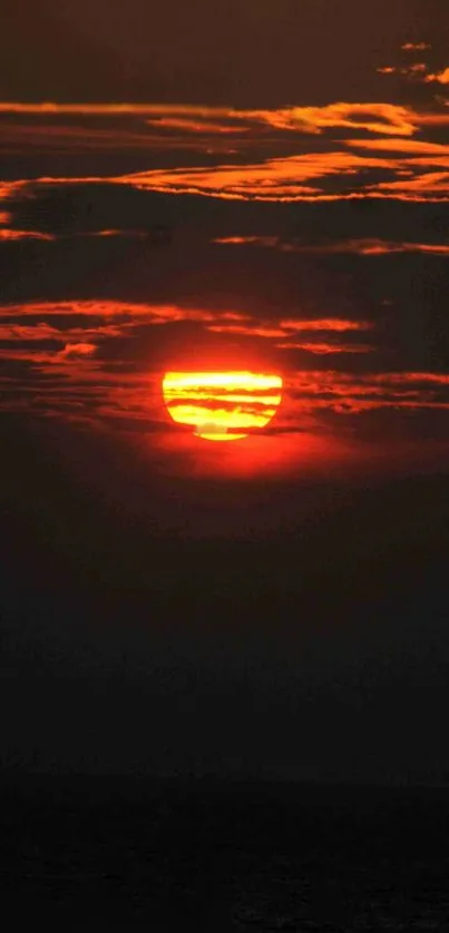 A vibrant orange sunset with dramatic clouds.