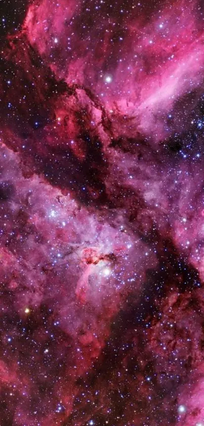 Vibrant pink and purple cosmic nebula wallpaper with bright stars.