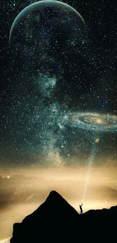 A breathtaking cosmic view with stars and galaxy over a mountain landscape.