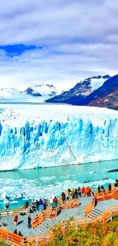 Majestic glacier against mountain backdrop in vibrant blue hues.