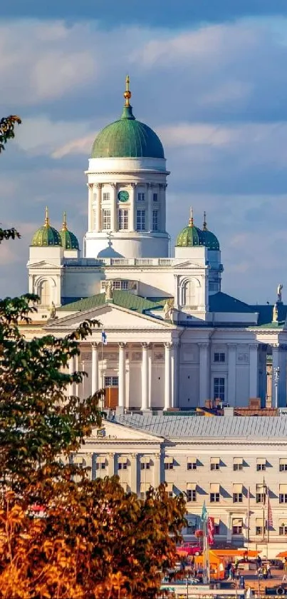 Helsinki cityscape with autumn trees and iconic architecture.