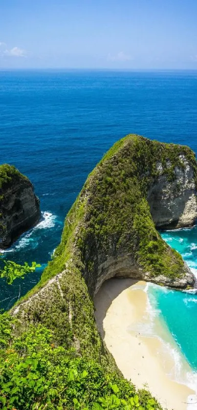 Tropical island beach with blue ocean and lush green cliffs