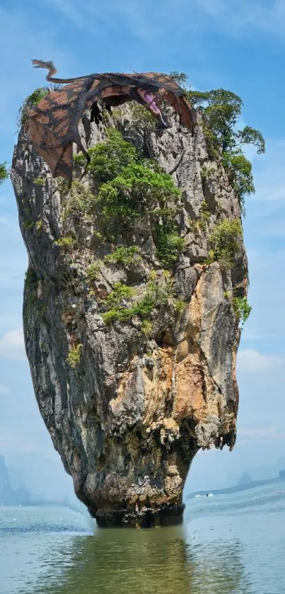 Tall island rock formation with greenery, set against a blue sky backdrop.