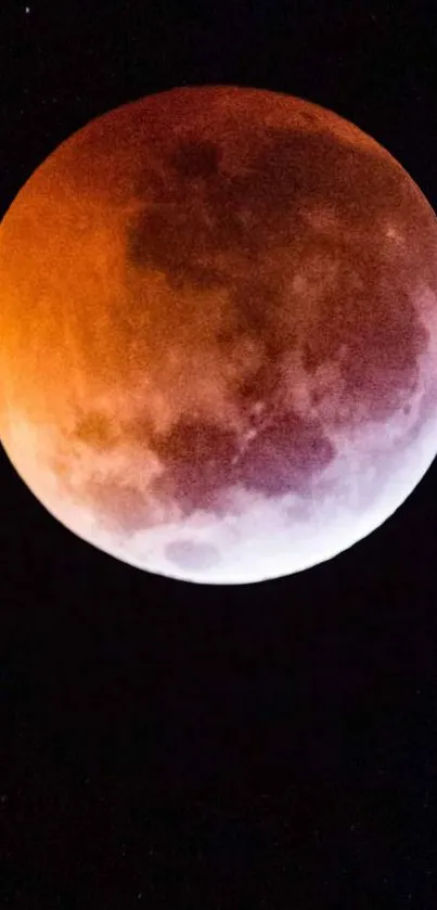 Lunar eclipse with vivid orange hue and celestial detail.