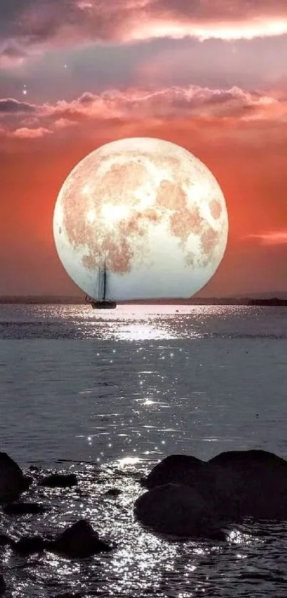 Moonrise over ocean with a vibrant sunset in the background.