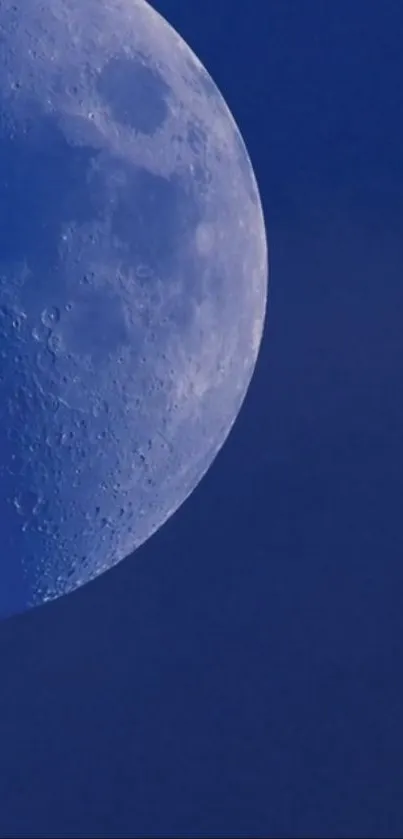 High-resolution wallpaper featuring a close-up of the moon in a blue night sky.