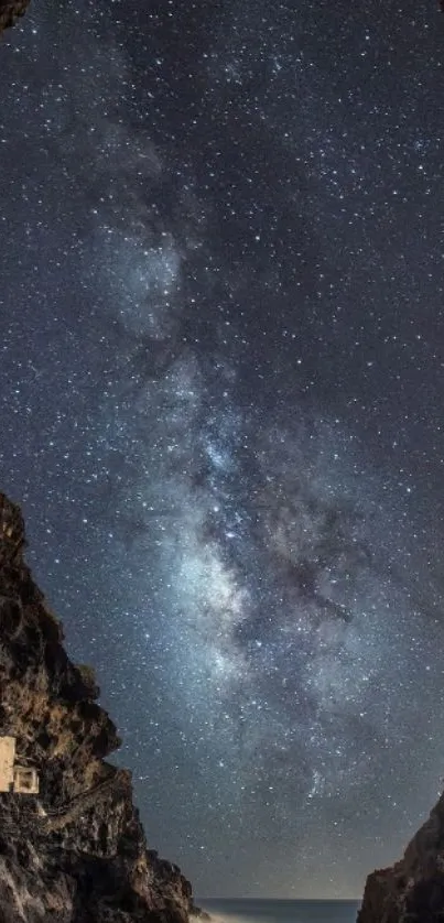 Milky Way galaxy framed by dark cave opening.