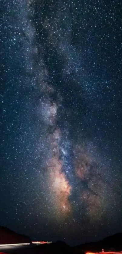 Mobile wallpaper featuring a stunning Milky Way galaxy against a starry night sky backdrop.