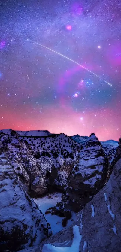 Milky Way over snow-capped canyon landscape wallpaper.