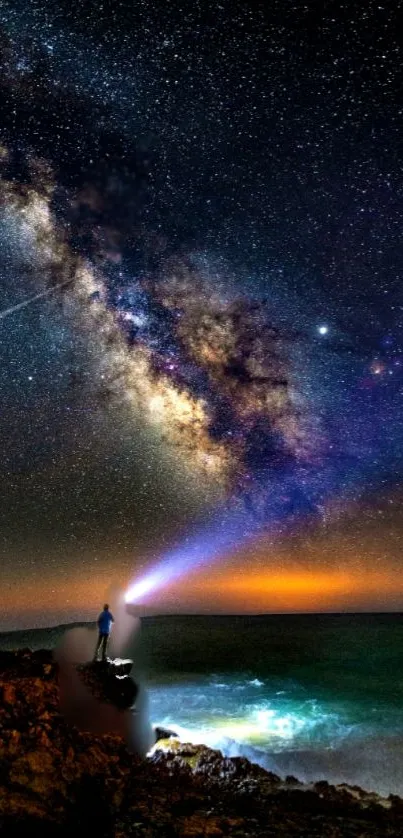 Milky Way in a vibrant night sky over an illuminated ocean with a lone figure.