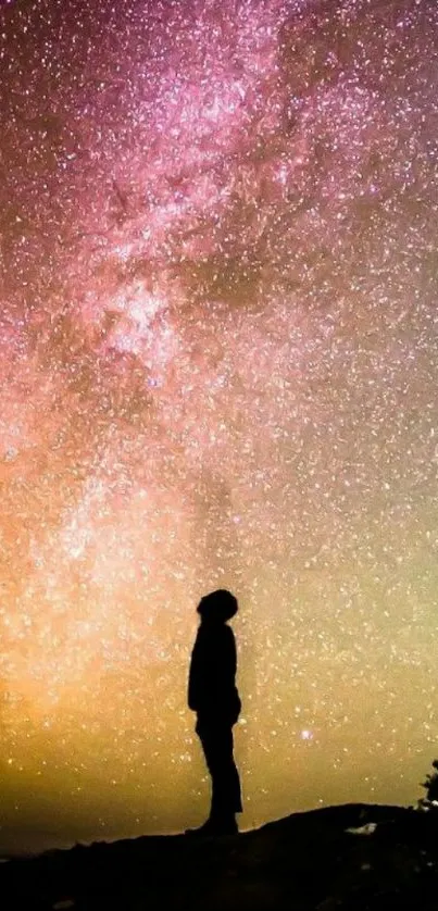 Silhouette against the Milky Way in a vibrant night sky wallpaper.