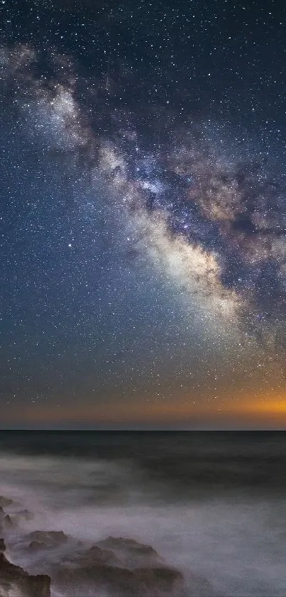 Milky Way over ocean with a starry night sky.