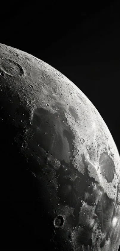 Close-up view of the moon's surface against a dark background.