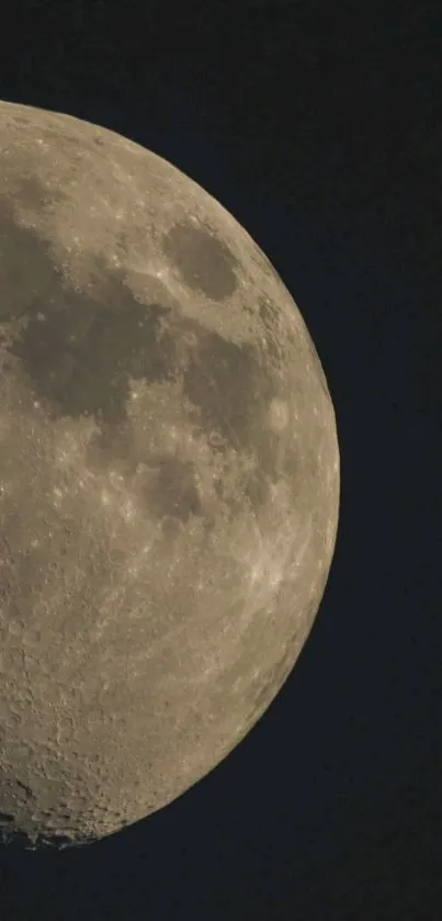 Close-up of the moon in a dark night sky, showcasing its craters and textures.