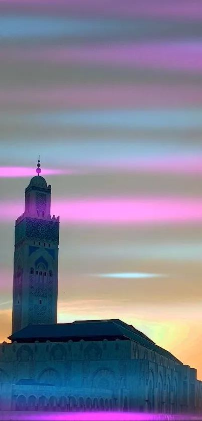 Majestic mosque silhouette with sunset hues over ocean front backdrop.