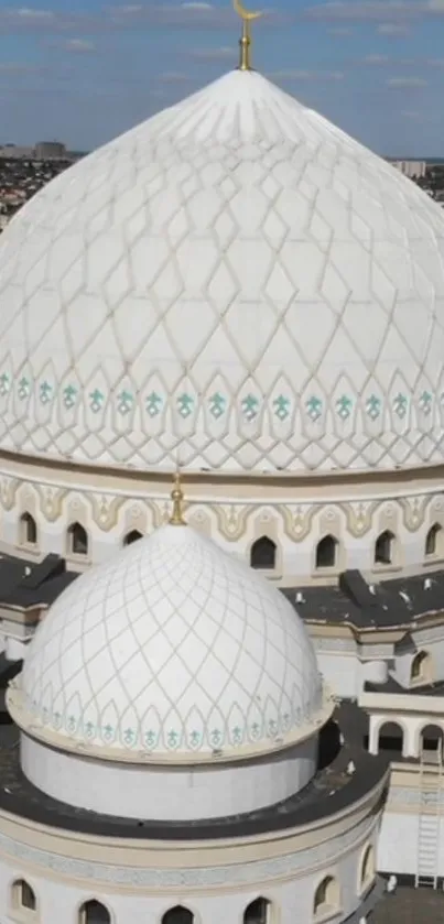 White mosque dome under a clear blue sky.