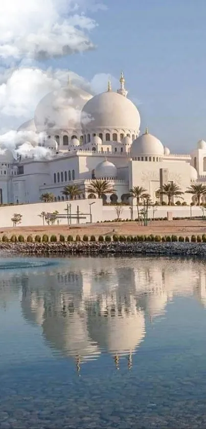 Mosque reflected in calm water under a clear blue sky.