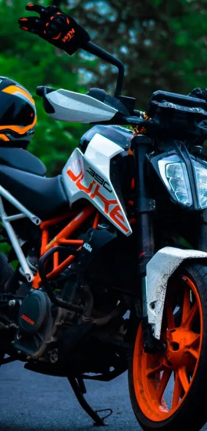 Stylish motorcycle with vibrant orange wheels and a black helmet in outdoor setting.