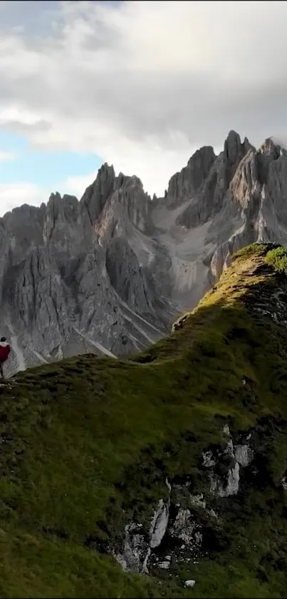 A breathtaking view of rugged mountains and lush greenery under a serene sky.