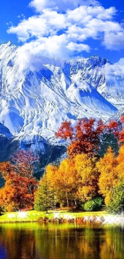 Snow-capped mountain with autumn trees reflected in a serene lake.