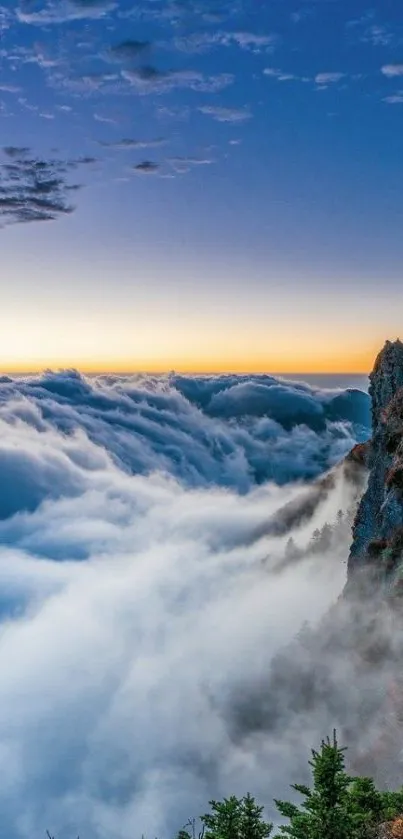 Mountain cloudscape wallpaper with blue sky and rugged cliffs.