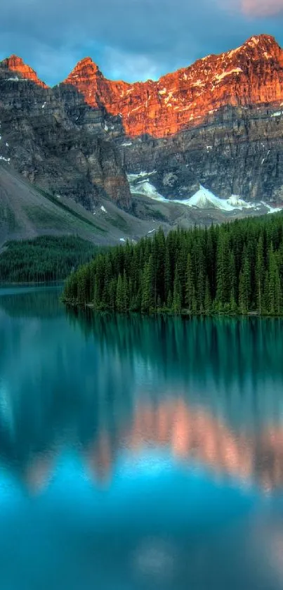 Sunset reflecting on a mountain lake with forests and vibrant colors.