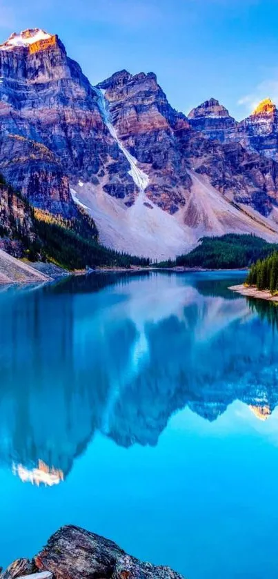 Beautiful crystal lake reflecting mountains and vibrant sky.