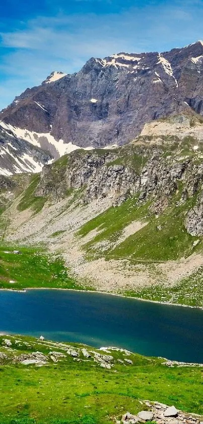 Mountain lake surrounded by rocky terrain and greenery.