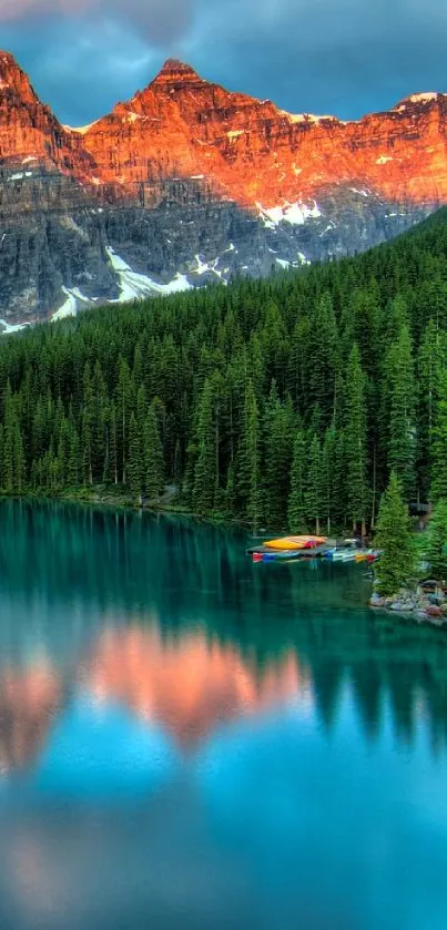 Stunning sunset over a serene mountain lake with lush forest.