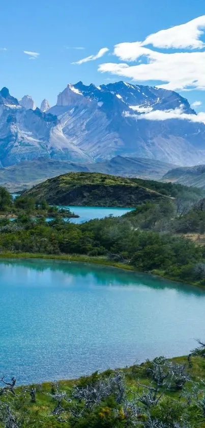 Turquoise mountain lake with blue sky and clouds.