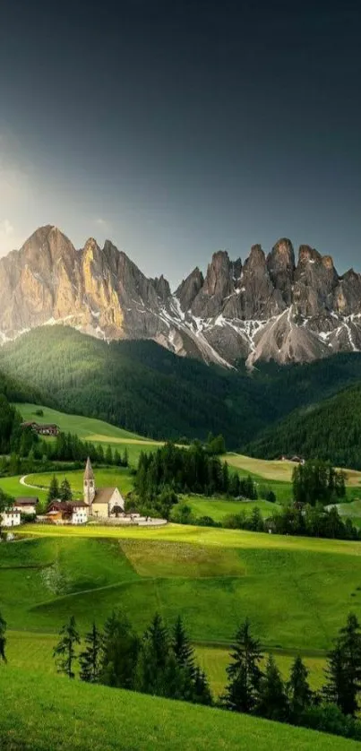 Lush green valley with majestic mountains under a blue sky.