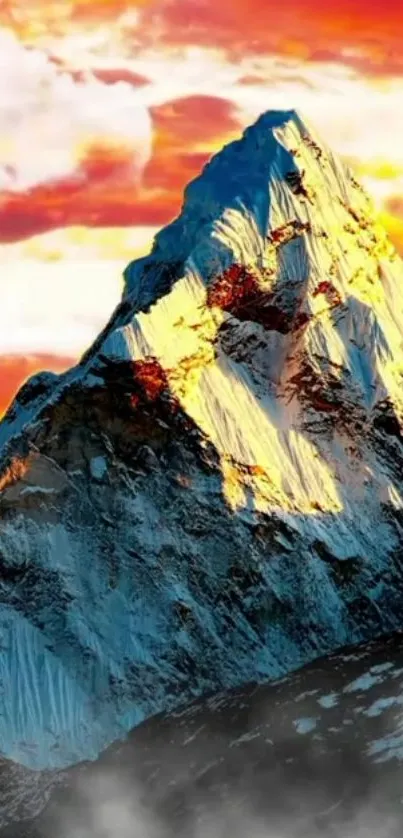 Majestic mountain peak with vibrant orange sunset sky.