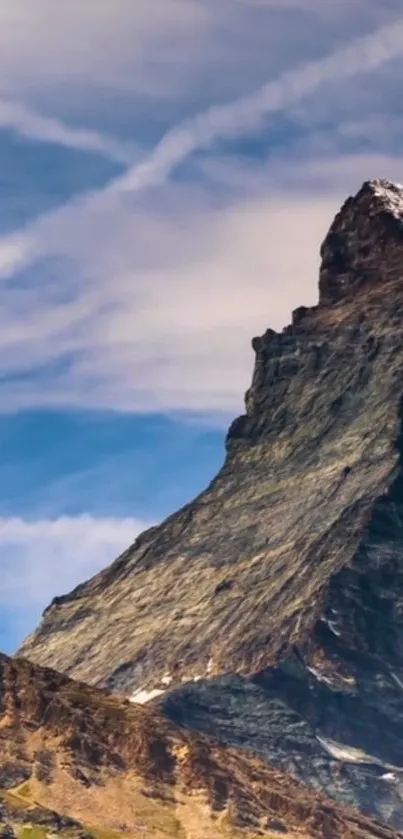 Majestic mountain peak with a clear blue sky background.