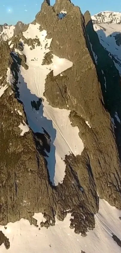 Majestic mountain peak with snow and a clear sky