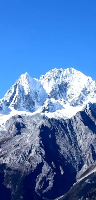 Majestic mountain range under a clear blue sky.