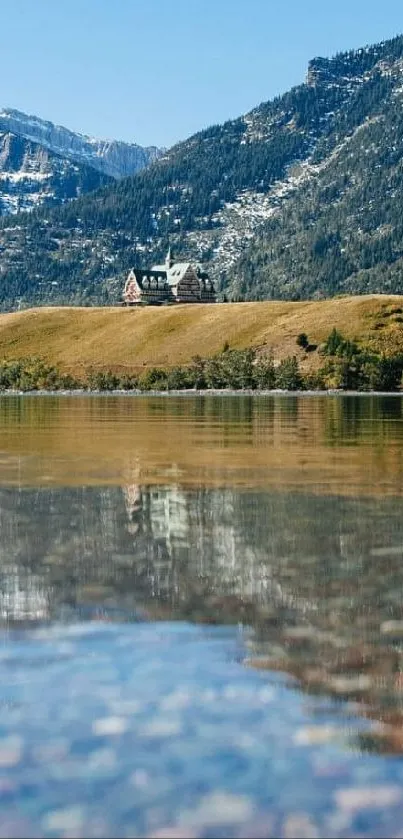 Majestic mountain reflection on clear Waterton Lake under a bright blue sky.