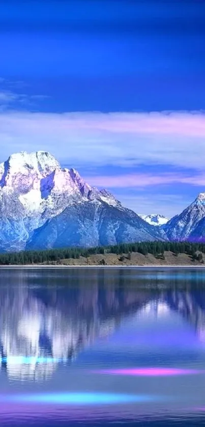 Majestic mountains reflecting in a tranquil lake under a vibrant blue sky.