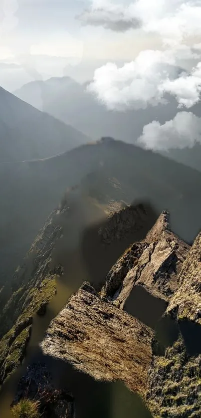 Breathtaking view of a mountain ridge with clouds overhead and rocky terrain.