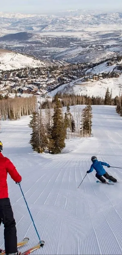 Skiers descend a snowy mountain with stunning panoramic views in this mobile wallpaper.