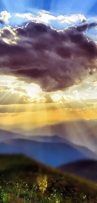 Majestic mountain sunrise with dramatic clouds and radiant sunbeams.