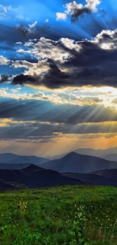 Mountain sunrise with vibrant rays and clouds.