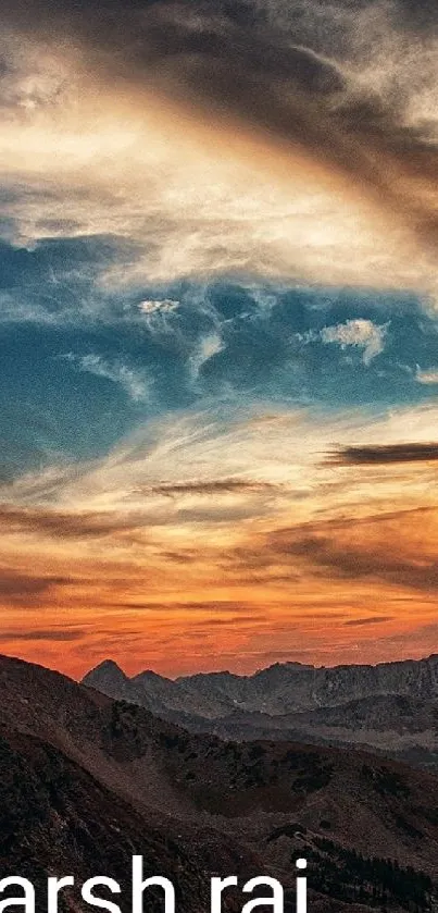 Breathtaking sunset over mountains with vibrant sky and clouds.