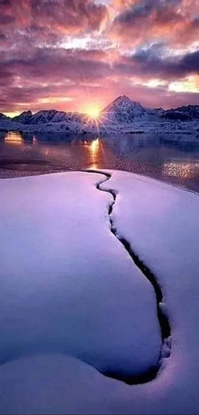 Stunning purple sunset over snowy mountains and lake.